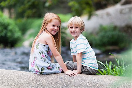 simsearch:6122-07705097,k - Children sitting on rock together Stock Photo - Premium Royalty-Free, Code: 6122-07705106
