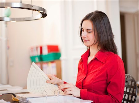 simsearch:649-05950551,k - Businesswoman organizing papers at desk Stock Photo - Premium Royalty-Free, Code: 6122-07705246