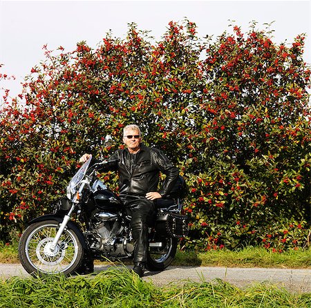 seniors motorcycle - Older man in leather on motorcycle Stock Photo - Premium Royalty-Free, Code: 6122-07705274