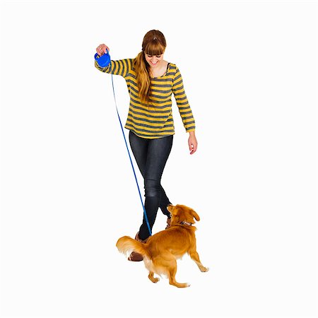 simsearch:614-02073683,k - Smiling woman walking dog Stock Photo - Premium Royalty-Free, Code: 6122-07705293