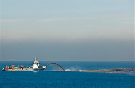 poured concrete construction - Industrial barge creating new land Stock Photo - Premium Royalty-Free, Code: 6122-07705340