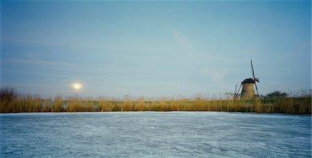 europe netherlands nature - Rural windmill on frozen river Stock Photo - Premium Royalty-Free, Code: 6122-07705337