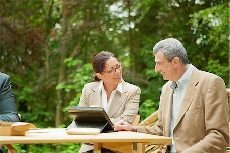 environmental issues for computers - Business people talking in meeting Stock Photo - Premium Royalty-Free, Code: 6122-07705597