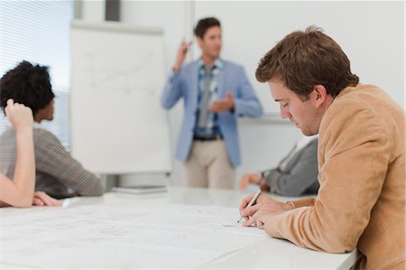 flip chart - Businessman making notes in meeting Photographie de stock - Premium Libres de Droits, Code: 6122-07705715