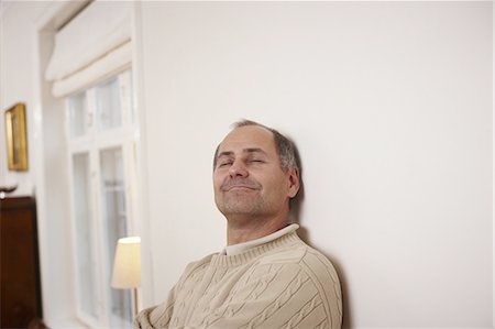 Older man relaxing in home Stock Photo - Premium Royalty-Free, Code: 6122-07705971