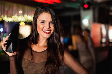 simsearch:649-08561395,k - Smiling woman standing in bar Stock Photo - Premium Royalty-Free, Code: 6122-07706167
