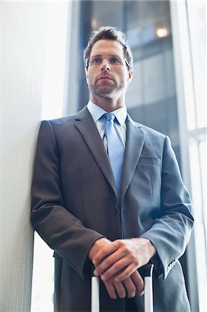 simsearch:649-06040105,k - Businessman standing with hands folded Fotografie stock - Premium Royalty-Free, Codice: 6122-07706179