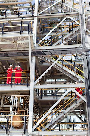 refinery confidence - Workers talking at oil refinery Stock Photo - Premium Royalty-Free, Code: 6122-07706272