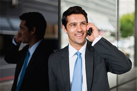 south africa and cellphone and talk - Businessman talking on cell phone Stock Photo - Premium Royalty-Free, Code: 6122-07706221