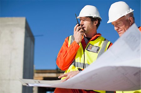 simsearch:649-06040775,k - Workers reading blueprints on site Stock Photo - Premium Royalty-Free, Code: 6122-07706354