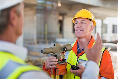 simsearch:649-06040775,k - Workers talking at construction site Stock Photo - Premium Royalty-Free, Code: 6122-07706361
