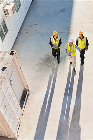 safety meeting from above - Workers casting shadows on site Stock Photo - Premium Royalty-Free, Code: 6122-07706397