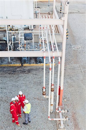 pipe oil - Workers talking at chemical plant Stock Photo - Premium Royalty-Free, Code: 6122-07706308