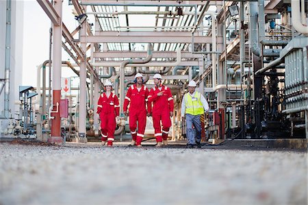 refinery confidence - Workers walking at chemical plant Stock Photo - Premium Royalty-Free, Code: 6122-07706310