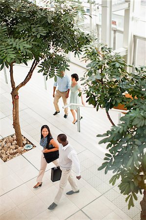 south africa and black and business - Business people walking in lobby Stock Photo - Premium Royalty-Free, Code: 6122-07706332