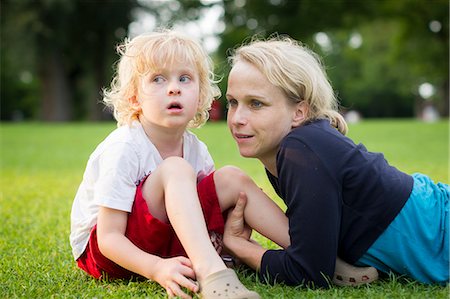 simsearch:6122-07705097,k - Mother and son sitting in grass Stock Photo - Premium Royalty-Free, Code: 6122-07706404