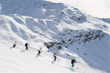 skier helmet - Skiers skiing together on slope Stock Photo - Premium Royalty-Free, Code: 6122-07706665