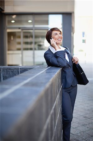 simsearch:649-06040232,k - Businesswoman talking on cell phone Stock Photo - Premium Royalty-Free, Code: 6122-07706745