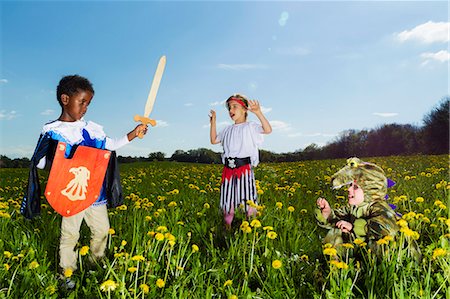 simsearch:6122-07700668,k - Boys playing dress up outdoors Stock Photo - Premium Royalty-Free, Code: 6122-07706773