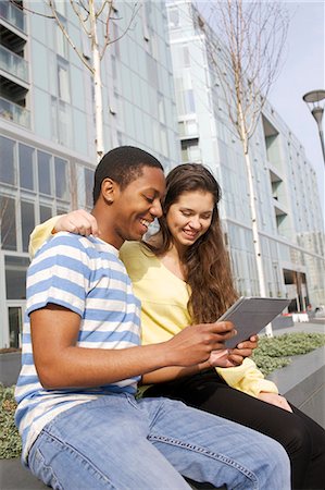 simsearch:649-06113019,k - Couple using tablet computer on street Stock Photo - Premium Royalty-Free, Code: 6122-07706866