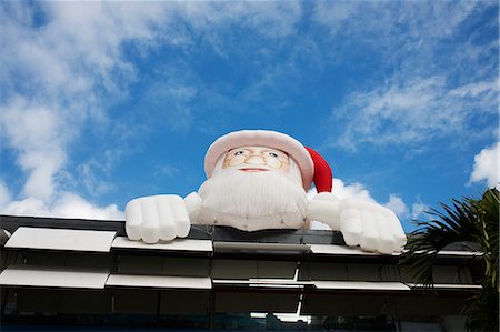 santa claus funny pic - Inflatable Santa Claus over building Stock Photo - Premium Royalty-Free, Code: 6122-07706827