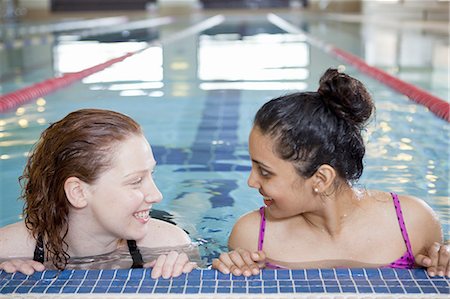 swimming pool leaning on edge - Women talking in indoor pool Stock Photo - Premium Royalty-Free, Code: 6122-07706992