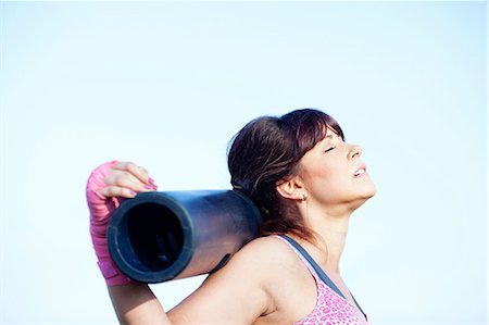 simsearch:649-03293611,k - Woman resting head on pole outdoors Stock Photo - Premium Royalty-Free, Code: 6122-07707032