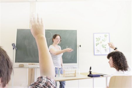 simsearch:6109-06196557,k - Teacher calling on students in class Stock Photo - Premium Royalty-Free, Code: 6122-07707143