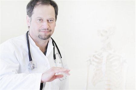 skeletons human not illustration not xray - Doctor wearing stethoscope Stock Photo - Premium Royalty-Free, Code: 6122-07707111