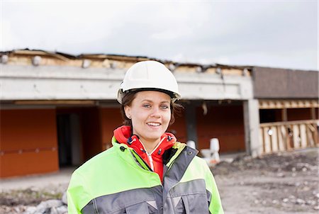 Worker standing on construction site Stock Photo - Premium Royalty-Free, Code: 6122-07707234