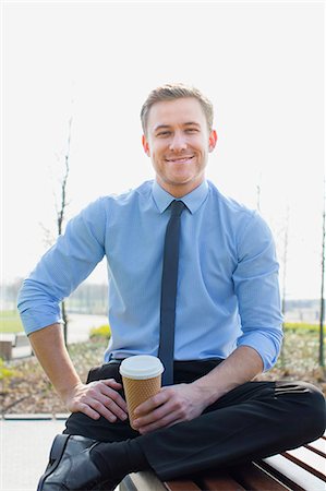 Businessman drinking coffee outdoors Stock Photo - Premium Royalty-Free, Code: 6122-07707422