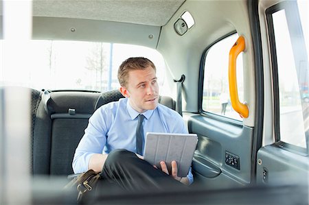 Businessman using tablet computer Foto de stock - Sin royalties Premium, Código: 6122-07707425