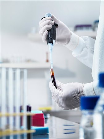 rubber gloves man - Scientist pipetting liquid in test tube Stock Photo - Premium Royalty-Free, Code: 6122-07707433