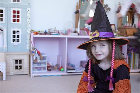 Girl wearing Halloween costume Stock Photo - Premium Royalty-Free, Code: 6122-07707537
