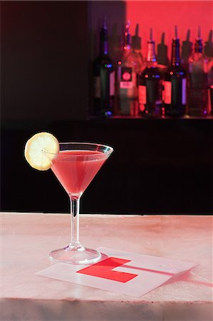 simsearch:6122-08212389,k - Pink cocktail and L plate on bar Stock Photo - Premium Royalty-Free, Code: 6122-08212390