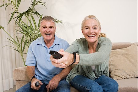 Mature couple playing video game Stock Photo - Premium Royalty-Free, Code: 6122-08212482