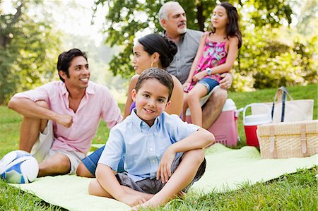 filipino family portrait - Three generation family at picnic in park, portrait Stock Photo - Premium Royalty-Free, Code: 6122-08212603