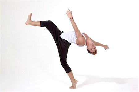 dancing on white background - Dancer balanced with one leg raised in the air Foto de stock - Sin royalties Premium, Código: 6122-08212730