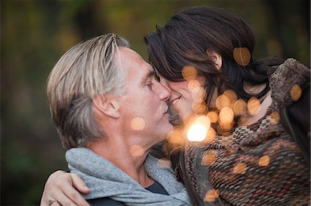 Affectionate mature couple with light from sparkler Photographie de stock - Premium Libres de Droits, Code: 6122-08212856