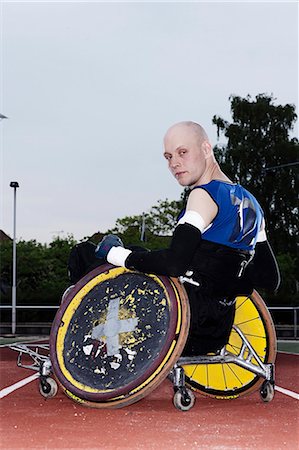 simsearch:632-06317852,k - Para rugby player in wheelchair on track Photographie de stock - Premium Libres de Droits, Code: 6122-08229019