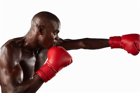 simsearch:6122-07700154,k - Boxer punching the air Stock Photo - Premium Royalty-Free, Code: 6122-08229034