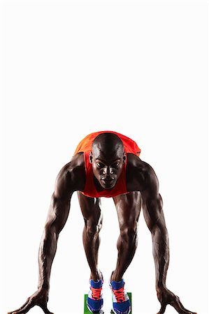 portrait of a runner - Runner crouched at starting line Stock Photo - Premium Royalty-Free, Code: 6122-08229039