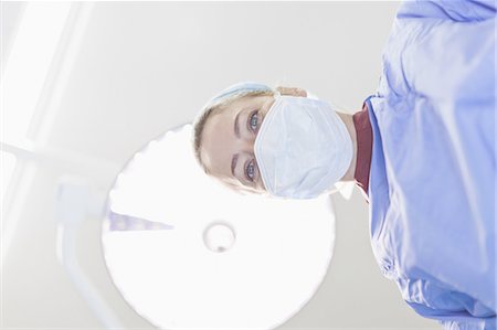Doctor examining patient on table Stock Photo - Premium Royalty-Free, Code: 6122-08229231