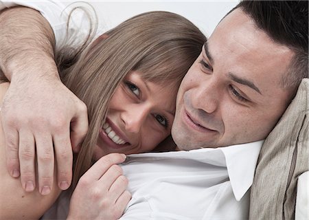 simsearch:6122-07703554,k - Close up of couple hugging on couch Stock Photo - Premium Royalty-Free, Code: 6122-08229836