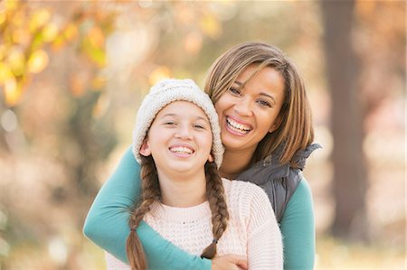 simsearch:6124-08170436,k - Portrait enthusiastic mother and daughter hugging outdoors Stock Photo - Premium Royalty-Free, Code: 6124-08170387