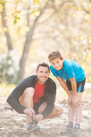 portraits fall - Portrait father and son preparing for hike in woods Stock Photo - Premium Royalty-Free, Code: 6124-08170389