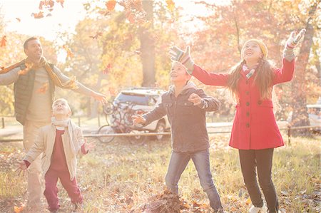 preteen girls playing at park photos - Family playing in autumn park Stock Photo - Premium Royalty-Free, Code: 6124-08170446