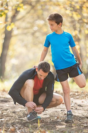 Father and son stretching and preparing to run Foto de stock - Sin royalties Premium, Código: 6124-08170403