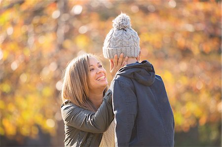 faces pleasure - Affectionate mother touching son's face outdoors Stock Photo - Premium Royalty-Free, Code: 6124-08170406