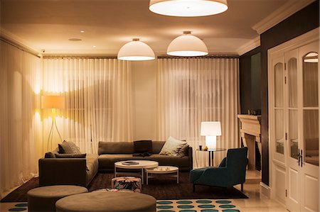 simsearch:6124-08170621,k - Illuminated domed lights over home showcase living room Photographie de stock - Premium Libres de Droits, Code: 6124-08170593